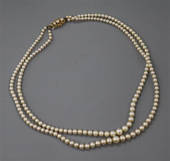 A double strand graduated cultured pearl necklace, with 9ct gold and cultured pearl clasp, 42cm.